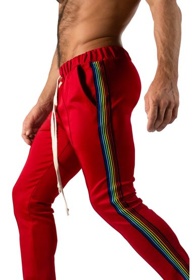 Red slim-fit jogging pants with rainbow side stripes